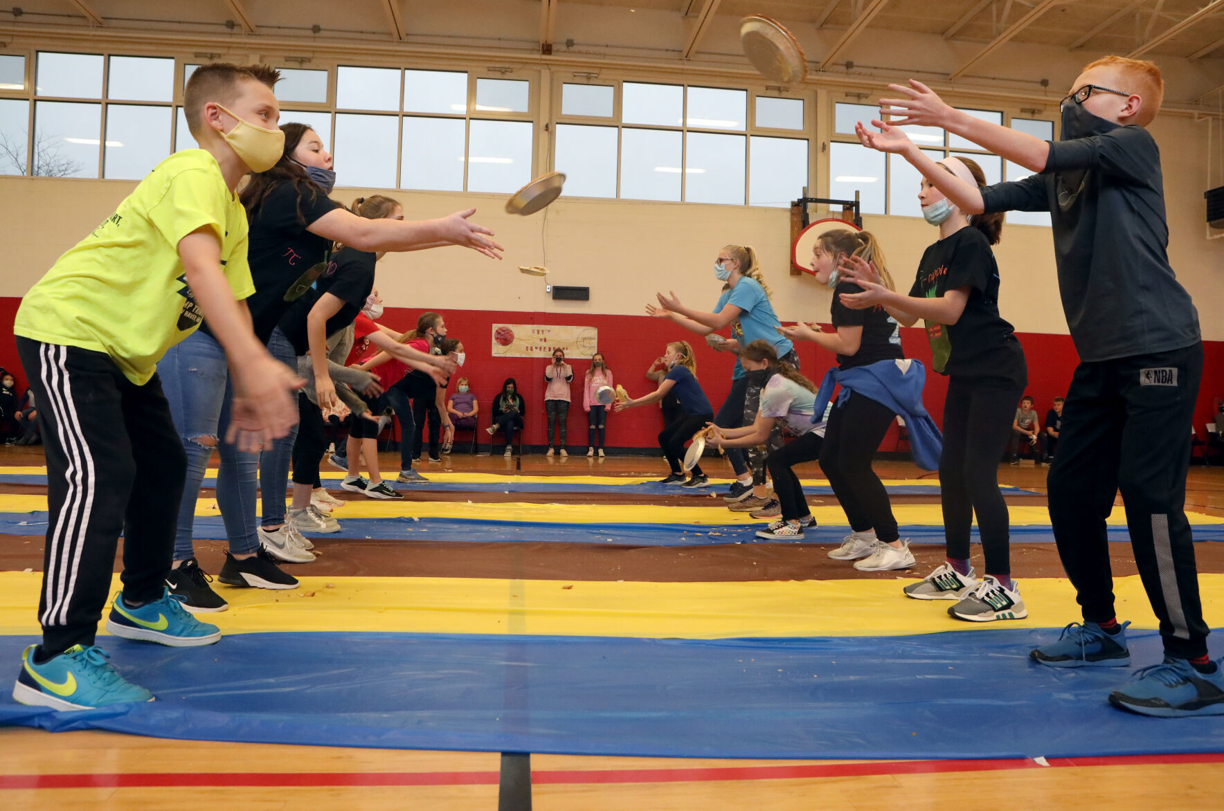 Students partake in a pie toss